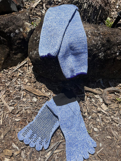 Pair of blue toe socks on a wooden surface